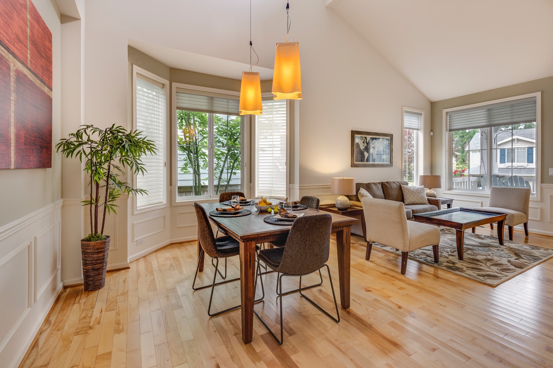A dining area with hardwood floors